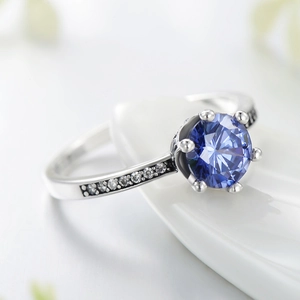 Luxurious S925 silver crown ring with a round blue zircon in a classic six-prong setting