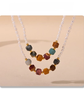Detail view of double-layer necklace with freshwater pearls and colorful natural stones