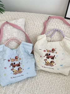 Quilted tote bag with cartoon dog embroidery and purple checkered woven handles