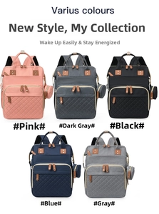 Quilted diaper backpacks in five colors with matching round coin purses and leather details
