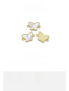 Detailed view of 18K gold plated butterfly pendants with natural shell inlay 17x11mm