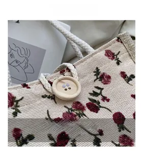 Detailed close-up of corduroy fabric with floral print and a rustic wooden button