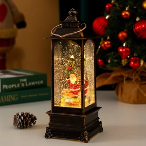 Close-up of a bronze Christmas lantern featuring Santa Claus and sparkling snow effect