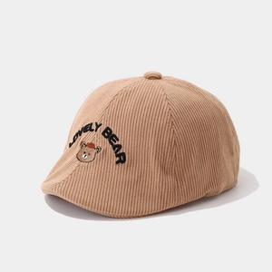 Detailed embroidery of Lovely Bear on brown corduroy baby beret hat with ribbed texture
