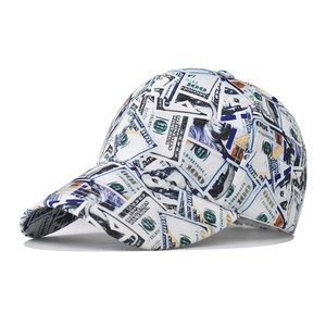 Detail of baseball cap featuring all-over dollar bill print and curved brim design