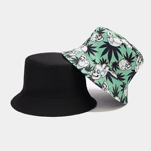 Detail of two-piece bucket hats showing stitching on black and skull cannabis print designs