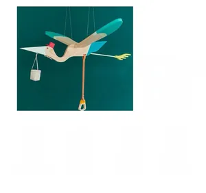 Eco-friendly wooden stork hanging toy with blue wings and orange pull ring detail