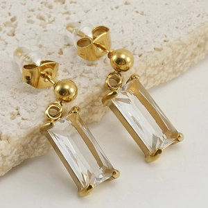 Detail of 18K gold stainless steel earrings with clear rectangular zircon crystals