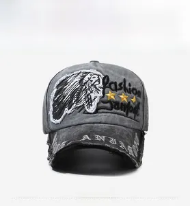 Detail of vintage washed baseball cap featuring Indian chief embroidery and frayed brim