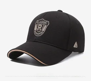 Detailed embroidery on a black sports baseball cap with a contrasting khaki brim edge
