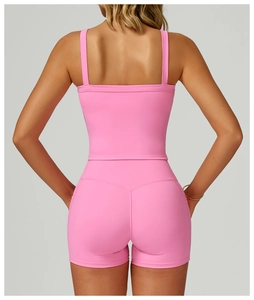 Rear view of pink double-strap yoga tank top and high-waist shorts set in matte finish