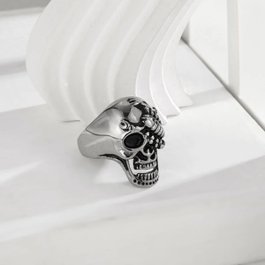 Gothic punk 316L stainless steel skull ring with detailed dark engravings on white stone