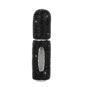 Detailed view of black rhinestone refillable perfume bottle with clear liquid level window