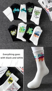 Detail of graffiti-style sports socks with black and white street fashion patterns