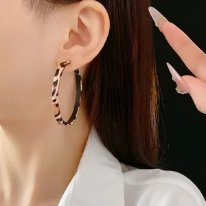 Exaggerated leopard print hoop earrings for women featuring a stylish large round design