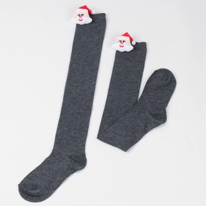 Detail view of dark grey knitted over-knee socks with plush Santa Claus doll decorations