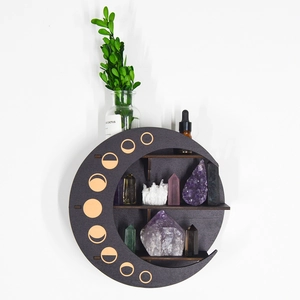 Macro detail of crescent moon wooden shelf featuring laser-cut moon phases for crystals