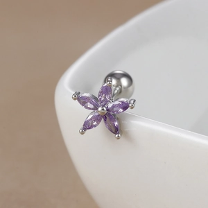 Detail of purple daisy earring with zircon petals on polished stainless steel stud
