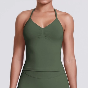 Close-up of ruched detail and seamless olive green fabric on halter neck sports top