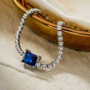 Elegant silver bracelet with large blue rectangular stone and sparkling cubic zirconia stones