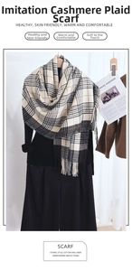 Detail view of the soft faux cashmere plaid scarf texture and classic fringe design