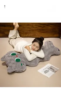 Detail of plush grey cat pillow with cozy lamb velvet texture and soft fabric material