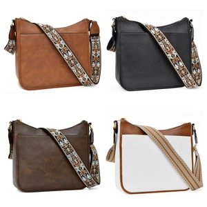 Detail showing four multi-colored crossbody bags with bohemian woven shoulder straps