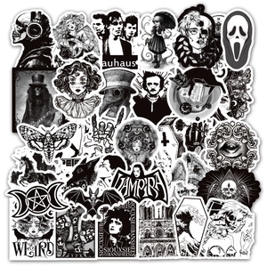 Close-up of black and white punk gothic stickers featuring skulls and rock band logos