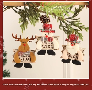 Close-up of fabric Christmas ornaments featuring Santa, Snowman and Reindeer with plaid hats