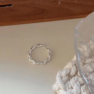 Minimalist 925 sterling silver chain link open ring on artistic textured background