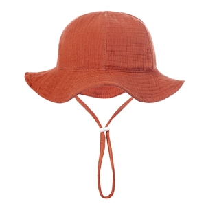 Detail of adjustable windproof drawstring and buckle on breathable cotton baby sun hat