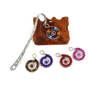 Handmade spiral metal bookmark with natural colorful beads and sun star charm pendants