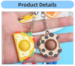 Close-up of food-shaped silicone pop fidget toys including a taco and cookie with keychains
