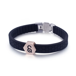 Men's black silicone sports bracelet with rose gold steel accents and honeycomb texture