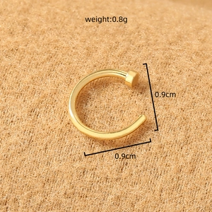 Detail of golden stainless steel U-shaped nose ring with 0.9cm dimensions