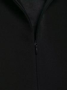 Close-up of high-quality invisible back zipper and fine plain weave fabric on black dress