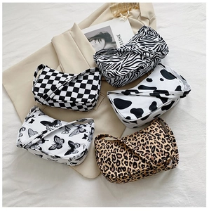 Fashionable underarm shoulder bags in zebra, cow, leopard, and checkerboard prints