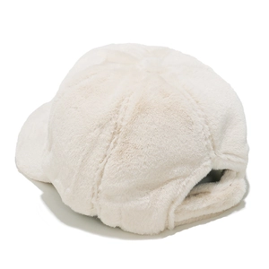 Detail showing the thick faux rabbit fur texture and six-panel stitching of the white cap