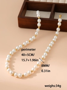 Detail showing 8mm faux pearls with gold beads and a 40+5cm adjustable chain