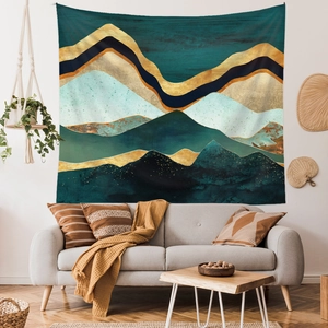 Abstract mountain wall tapestry in navy and gold above a sofa in a modern living room