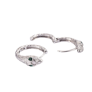 Silver snake hoop earrings with green crystal eyes and a unique hinged closure
