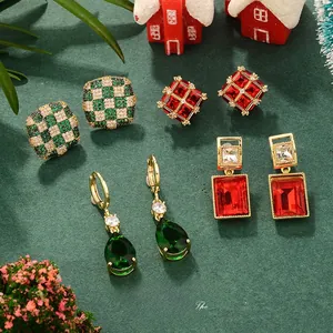 Detail of checkered and gemstone earrings with festive red and green holiday accents