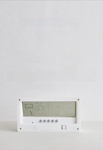 Detail of five white control buttons on LCD digital alarm clock for easy mode setting