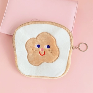Close-up of cute plush toast coin purse with smiling embroidery and metal zipper