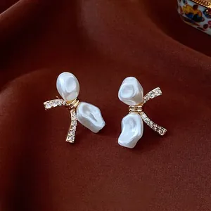 Elegant 18k gold plated bowknot earrings with baroque pearls and sparkling zircons