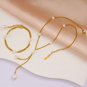 Detailed macro of golden necklace set with white pearls and K18 hallmark on metal tag