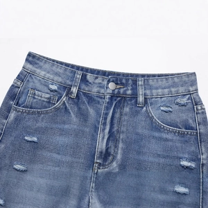 Blue distressed denim shorts featuring ripped details and classic button waist closure