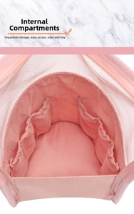 Close-up of pink mesh makeup bag interior featuring elastic divider pockets and large main section