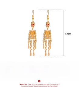 Detail view of golden gothic skeleton earrings with dimensions and specifications