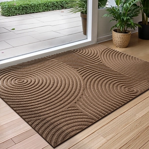 Macro view of brown entryway mat with 3D wave pattern for dirt scraping and nonslip use